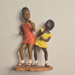 Dancing Sisters Figurine - Orange and Yellow.  By Brenda Joysmith